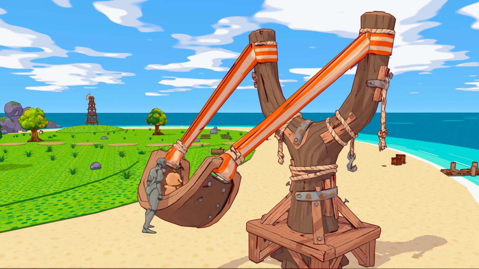 The caretaker in the pouch of a giant rope-and-timber slingshot on the beach